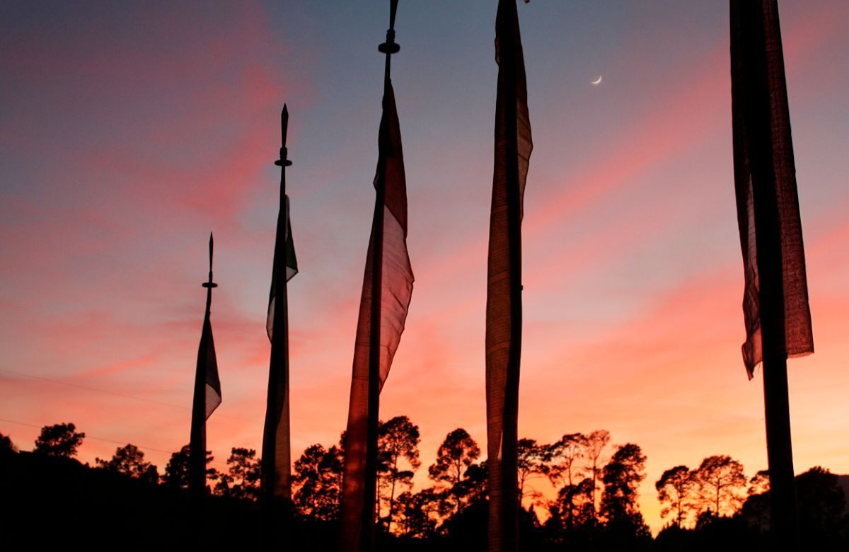 Prayer flags against an evening sky