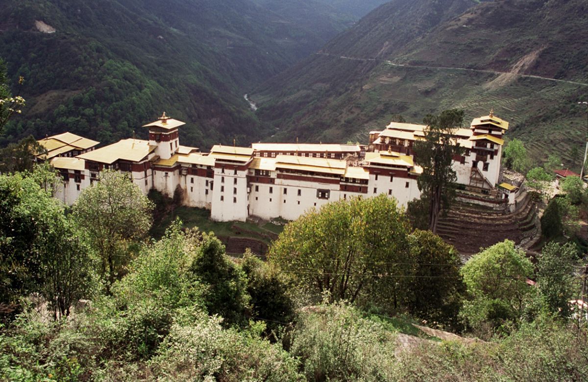 A Bhutanese dzong on a forested ridge