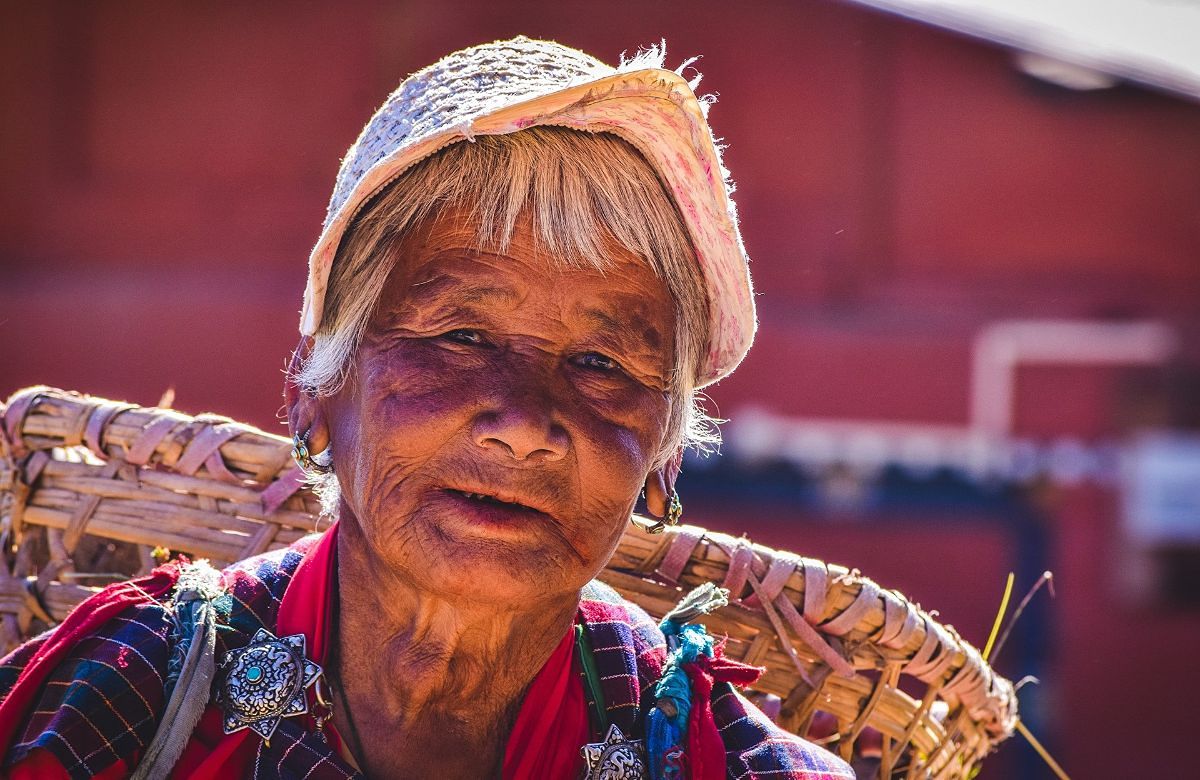 A Bhutanese woman carrying a woven basket