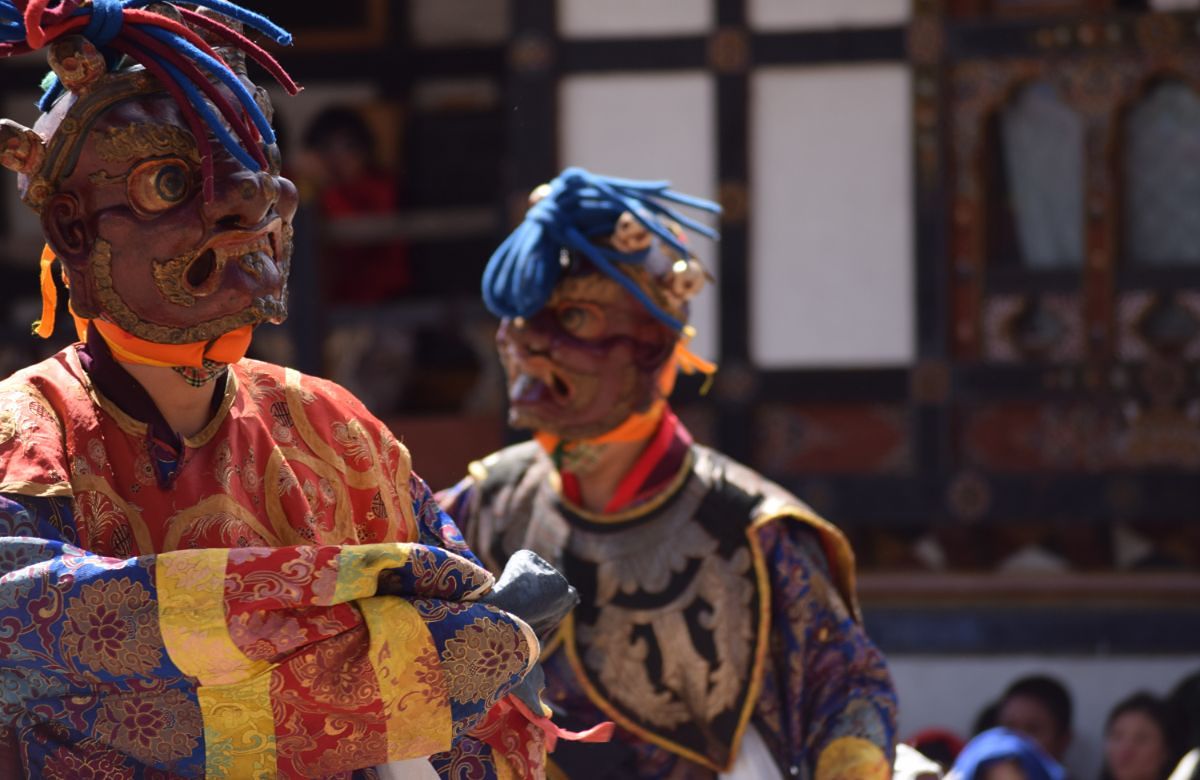 A masked cham dancer in close-up