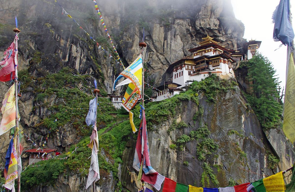 Prayer flags on the cliff below Paro Taktsang