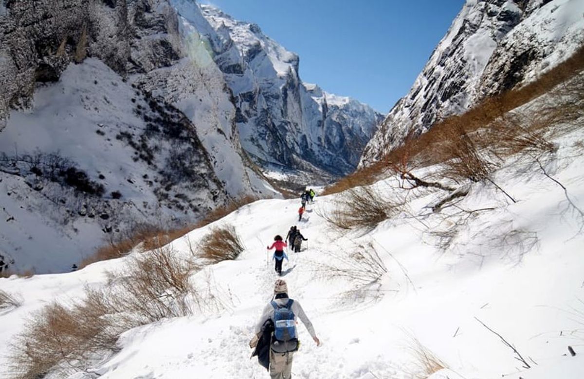 Trekkers crossing a high snow pass