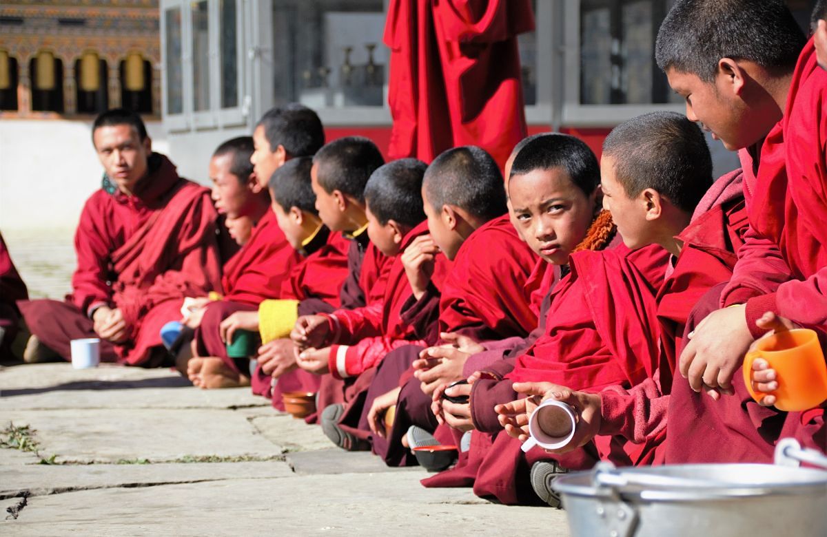 Young monks at a monastery meal in Bumthang